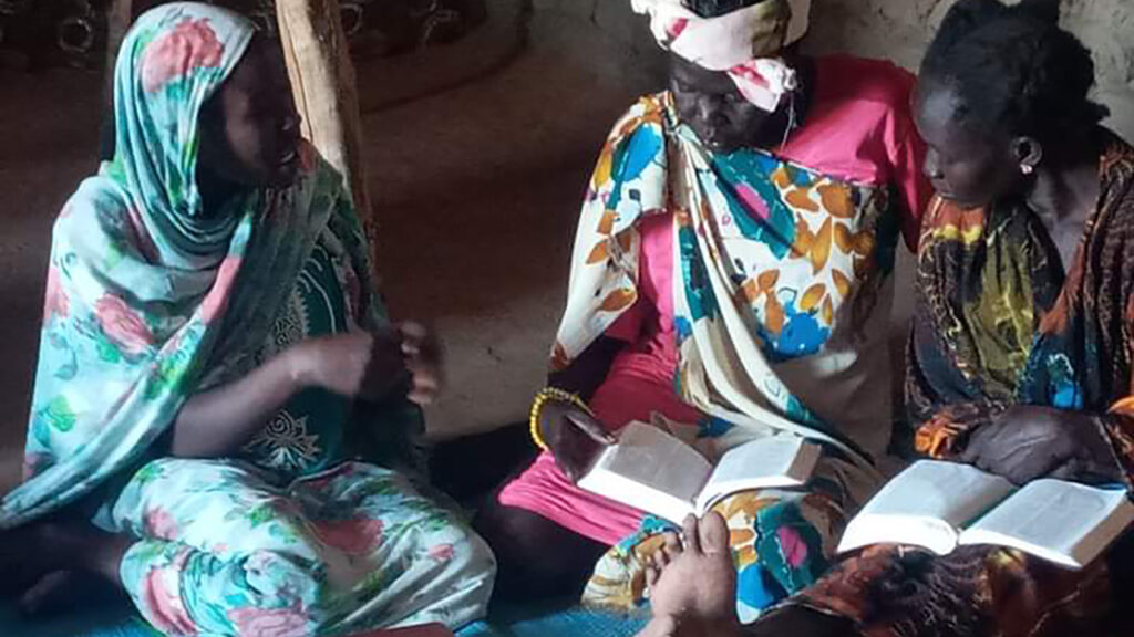 Photo of women studying the Bible in a home