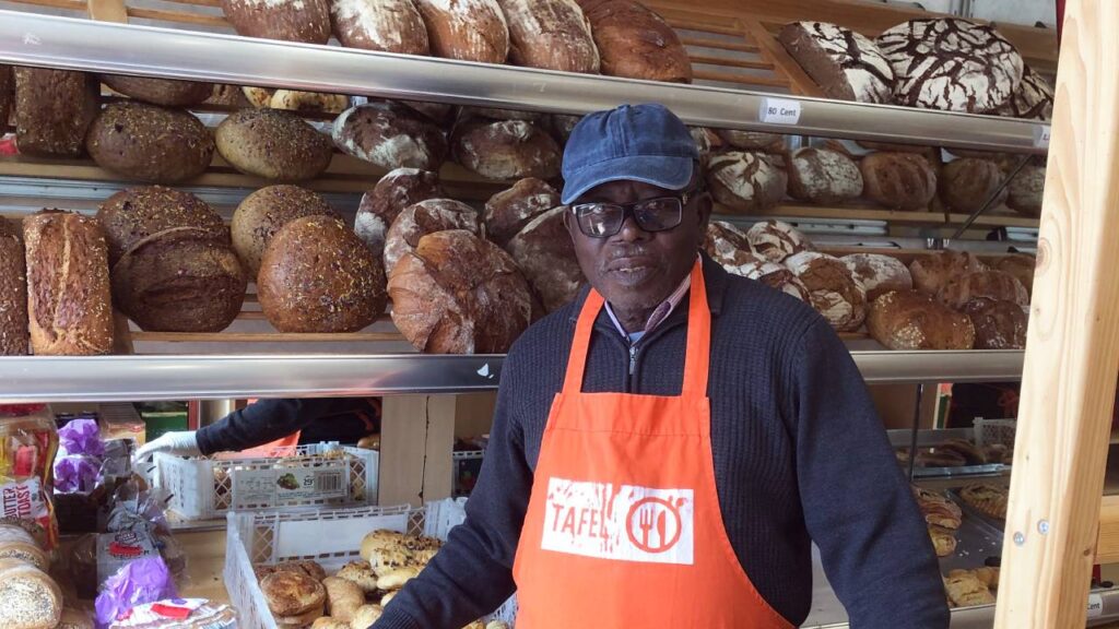 Photo of AFCI Ghana National Director in a bread shop