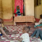 Khamisa teaching children in her home