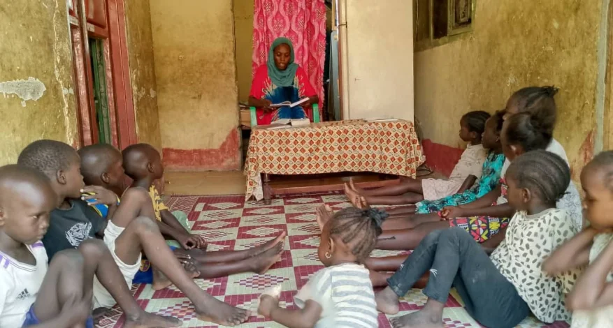 Khamisa teaching children in her home